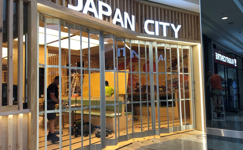 Striking Bi-folding transparent doors secure retail, commercial and hospitality applications